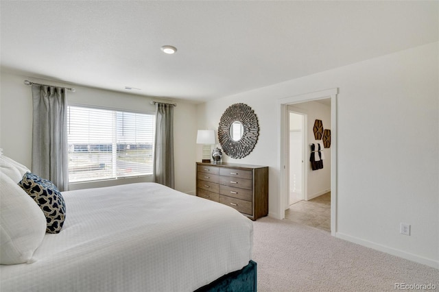 11782 Foraker Ln, Colorado Springs, CO 80925 - bedroom featuring light carpet and baseboards