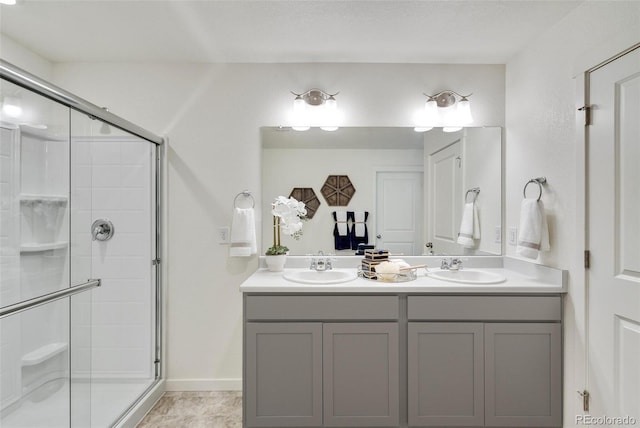 11782 Foraker Ln, Colorado Springs, CO 80925 - bathroom featuring double vanity and a shower stall