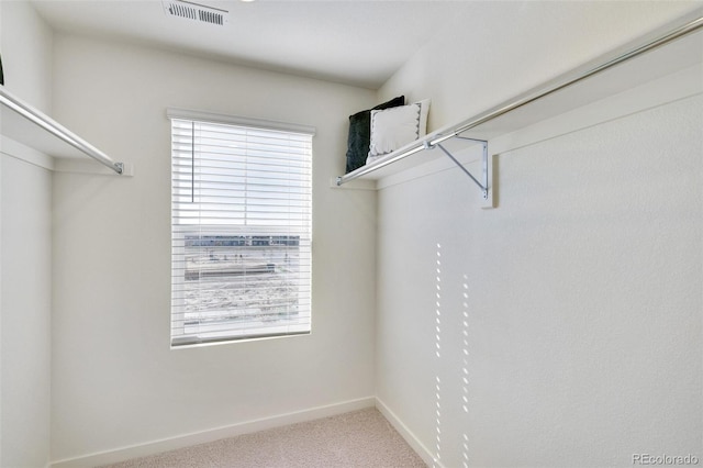 11782 Foraker Ln, Colorado Springs, CO 80925 - spacious closet featuring carpet floors