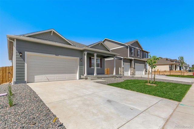 13487 Valentia St, Thornton, CO 80602 - view of front of house with concrete driveway, a garage, and covered porch