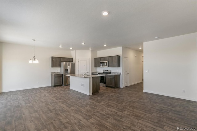 13487 Valentia St, Thornton, CO 80602 - kitchen with stainless steel appliances, open floor plan, dark wood-style flooring, and recessed lighting