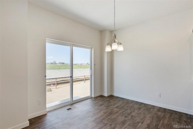 13487 Valentia St, Thornton, CO 80602 - unfurnished room with a chandelier, dark wood-type flooring, baseboards, and a water view