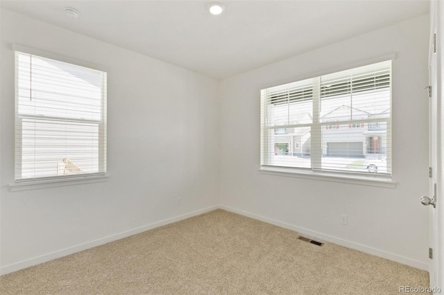 13487 Valentia St, Thornton, CO 80602 - spare room with carpet floors, baseboards, and a smoke detector