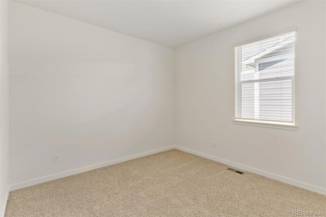 13487 Valentia St, Thornton, CO 80602 - spare room featuring light carpet and baseboards