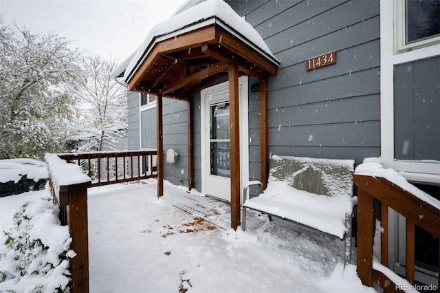 view of snow covered deck