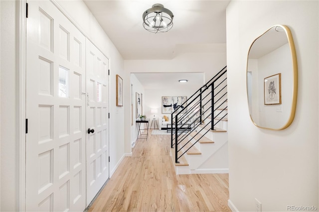 entryway with light hardwood / wood-style floors