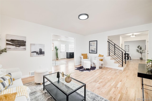 living room with light hardwood / wood-style floors