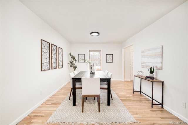 dining space with light wood-type flooring