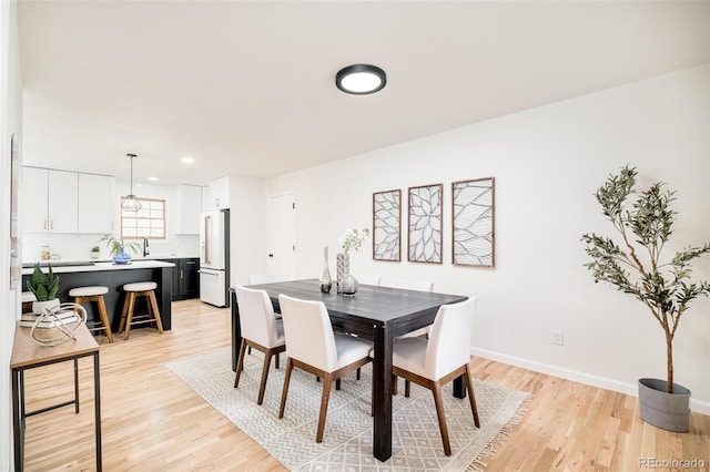 dining room with light hardwood / wood-style flooring