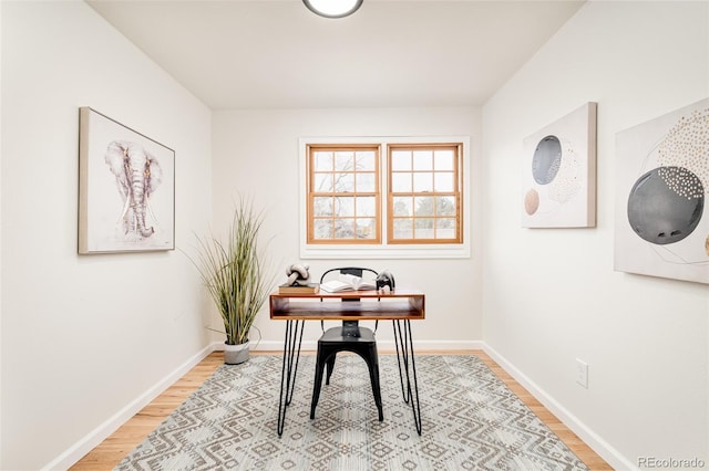 office space with light hardwood / wood-style floors