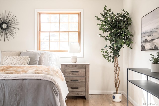 bedroom with hardwood / wood-style floors