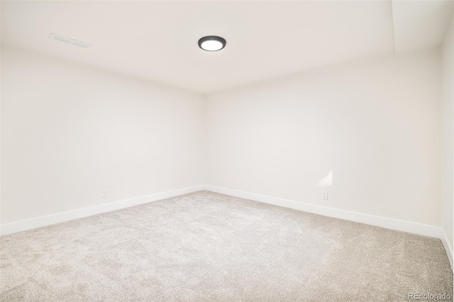 empty room featuring carpet floors