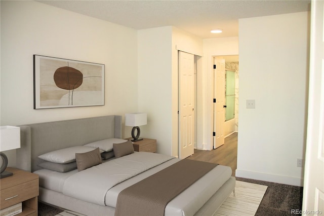 14780 E Kentucky Dr Unit 414, Aurora, CO 80012 - bedroom featuring baseboards and a closet