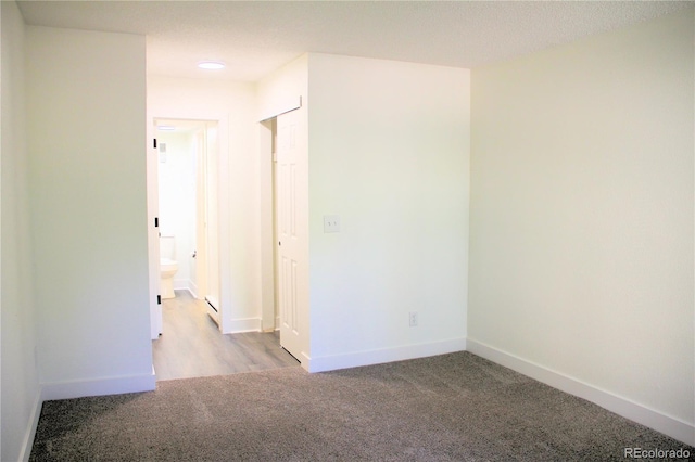 14780 E Kentucky Dr Unit 414, Aurora, CO 80012 - unfurnished room featuring carpet floors and a baseboard radiator