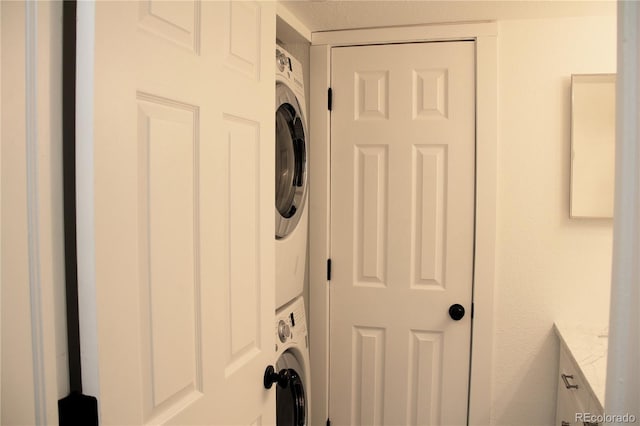 14780 E Kentucky Dr Unit 414, Aurora, CO 80012 - laundry area featuring stacked washing machine and dryer