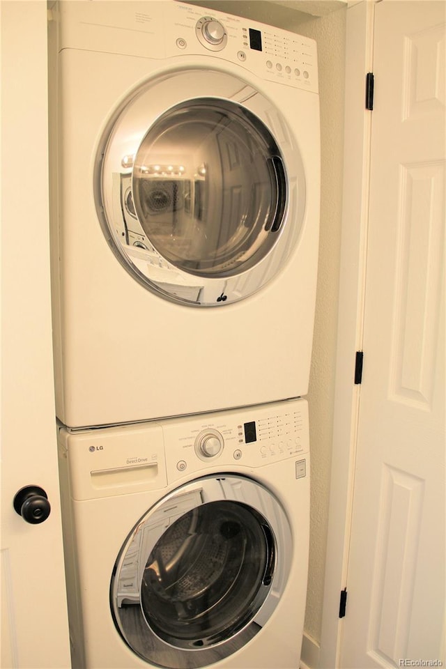 14780 E Kentucky Dr Unit 414, Aurora, CO 80012 - laundry area with estacked washer and dryer