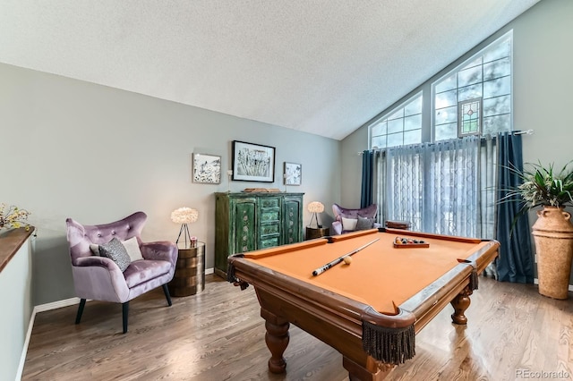 10360 Irving Ct, Westminster, CO 80031 - recreation room with a textured ceiling, vaulted ceiling, billiards, and wood finished floors