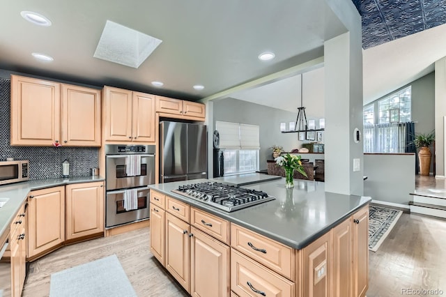 10360 Irving Ct, Westminster, CO 80031 - kitchen with appliances with stainless steel finishes, light wood-style floors, light brown cabinetry, and recessed lighting