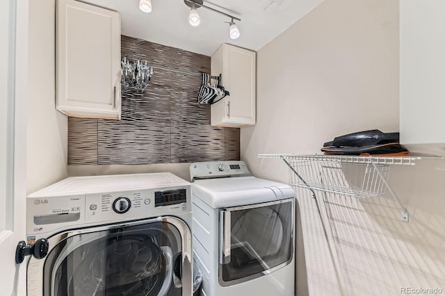 10360 Irving Ct, Westminster, CO 80031 - laundry area with washer and dryer, cabinet space, and track lighting