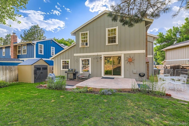 10360 Irving Ct, Westminster, CO 80031 - back of property featuring a patio area, a storage shed, and board and batten siding