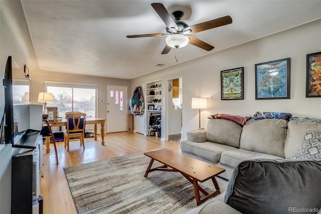6095 W 47th Ave, Wheat Ridge, CO 80033 - living area featuring a ceiling fan and light wood finished floors