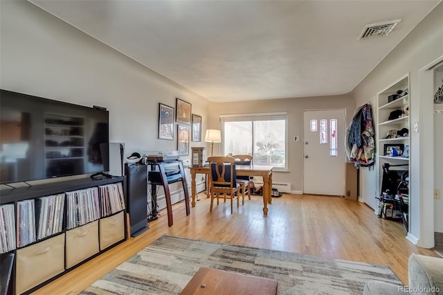 6095 W 47th Ave, Wheat Ridge, CO 80033 - dining space featuring wood finished floors and baseboards