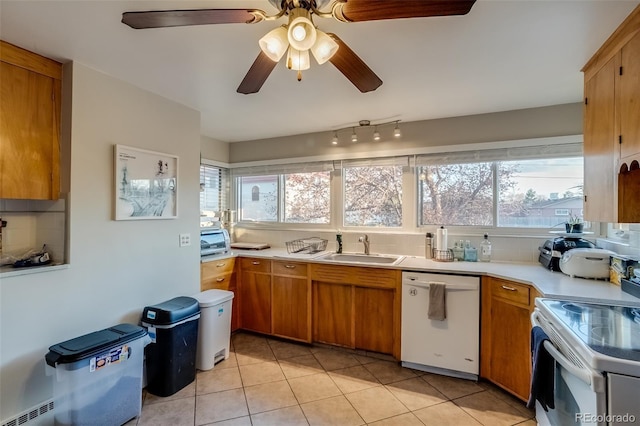 6095 W 47th Ave, Wheat Ridge, CO 80033 - kitchen with white appliances, a sink, light countertops, and decorative backsplash