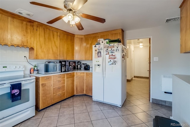 6095 W 47th Ave, Wheat Ridge, CO 80033 - kitchen with white appliances, light countertops, light tile patterned floors, and ceiling fan
