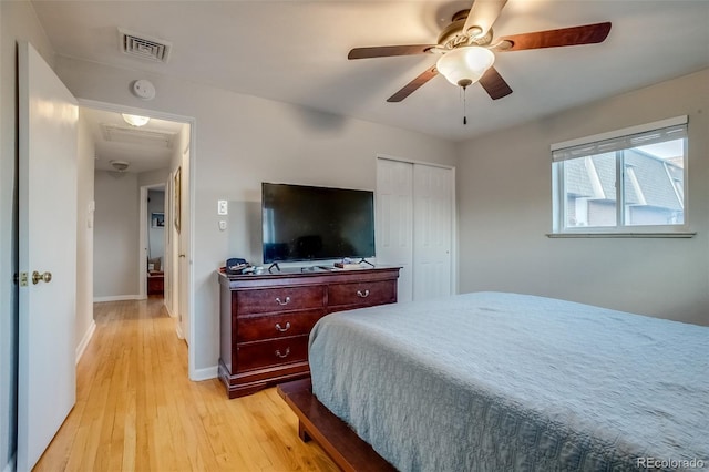 6095 W 47th Ave, Wheat Ridge, CO 80033 - bedroom featuring light wood-style flooring, a closet, baseboards, and a ceiling fan