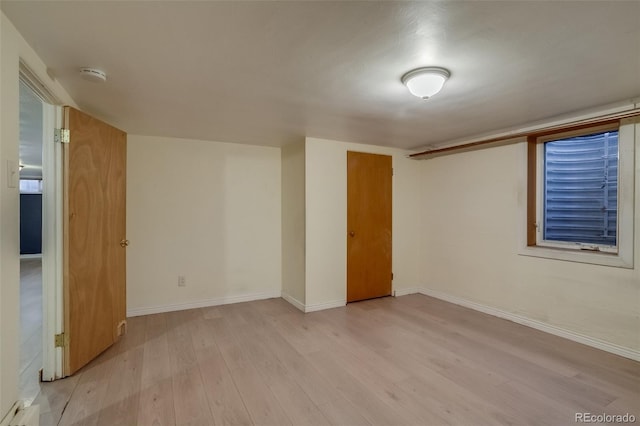 6095 W 47th Ave, Wheat Ridge, CO 80033 - unfurnished room with a smoke detector, light wood-style floors, and baseboards