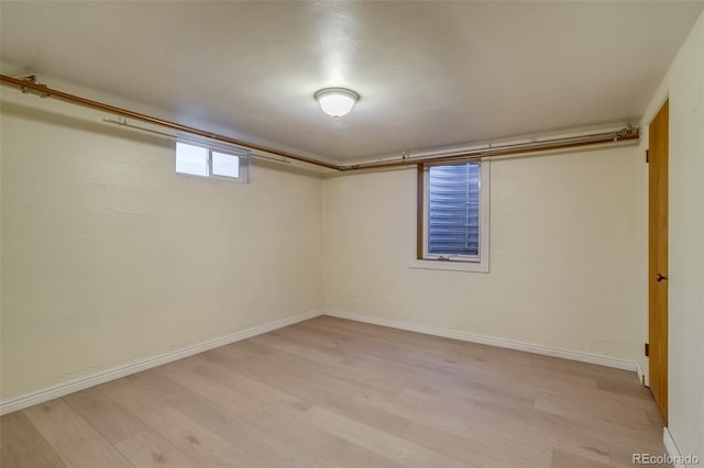 6095 W 47th Ave, Wheat Ridge, CO 80033 - below grade area with light wood-style flooring and baseboards