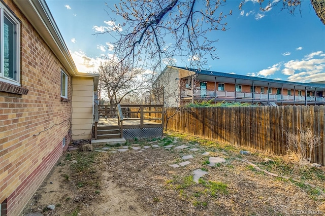 6095 W 47th Ave, Wheat Ridge, CO 80033 - fenced backyard featuring a deck