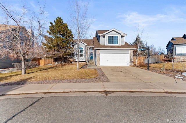 view of front of property featuring a garage and a front yard