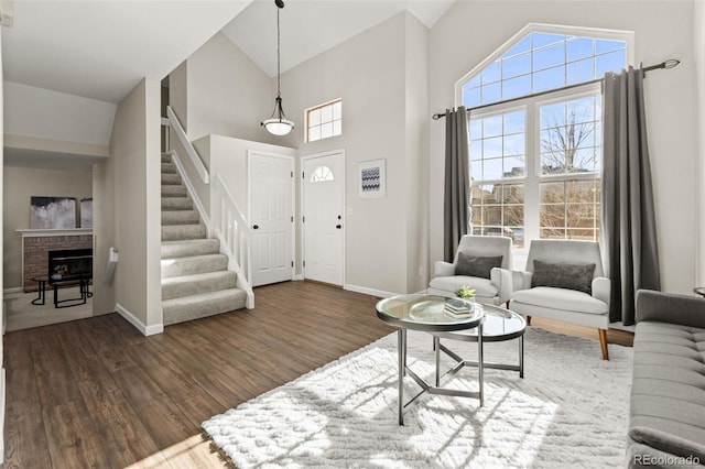 living room featuring dark wood-type flooring and a towering ceiling