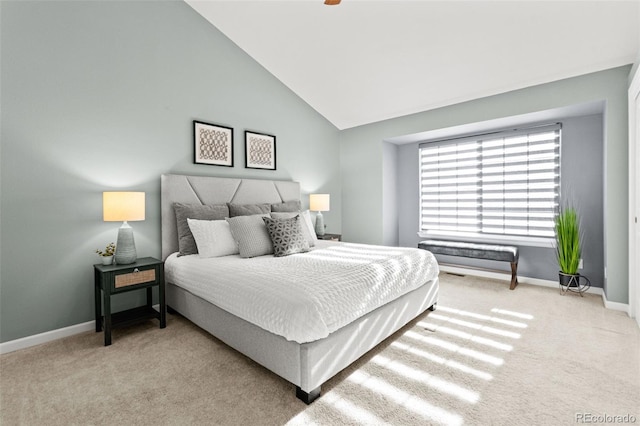 carpeted bedroom with vaulted ceiling