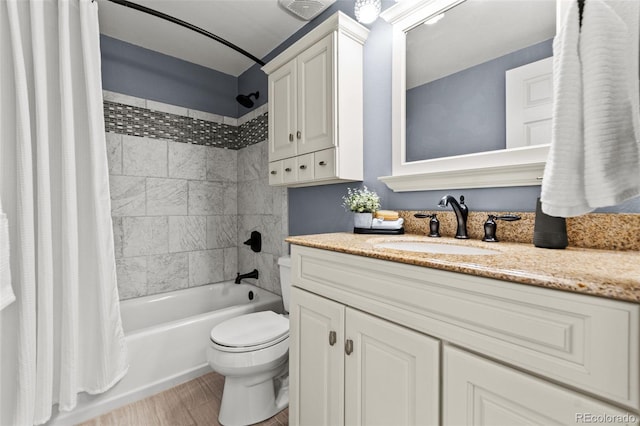 full bathroom featuring vanity, wood-type flooring, shower / bath combination with curtain, and toilet