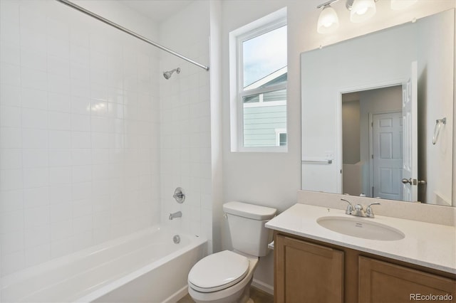 full bathroom featuring vanity, toilet, and tiled shower / bath combo