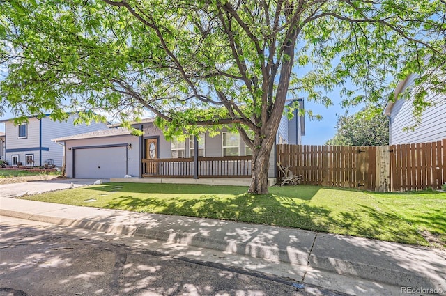 view of front of house featuring concrete driveway and an attached garage