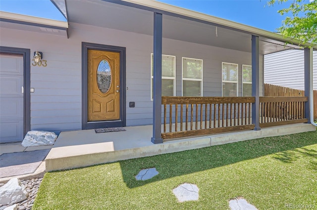 doorway to property featuring a porch