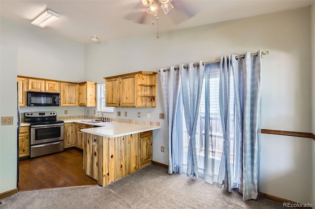kitchen with stainless steel electric stove, black microwave, a sink, light countertops, and a ceiling fan