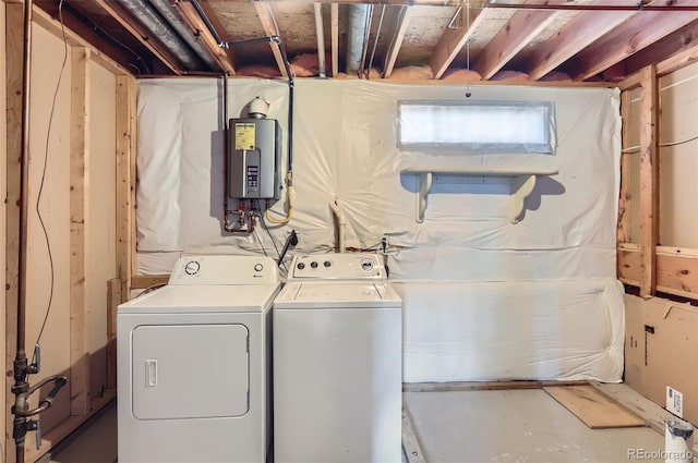 laundry area featuring water heater and washer and clothes dryer