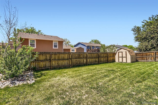 view of yard with a shed and an outbuilding