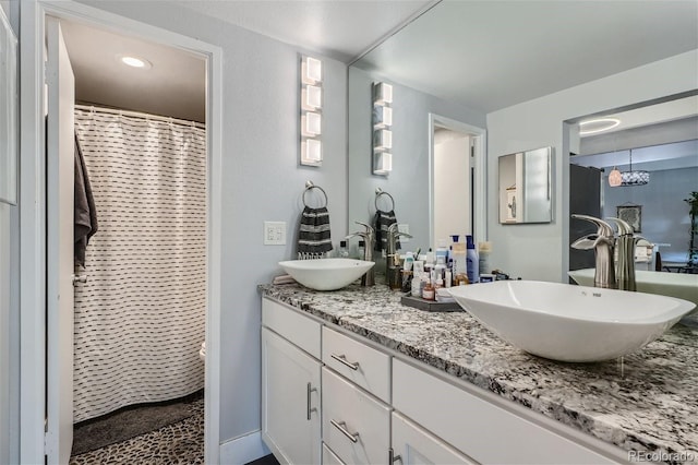 bathroom featuring vanity and a shower with curtain