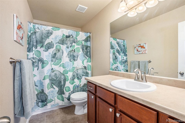 bathroom featuring toilet, tile patterned flooring, visible vents, and vanity