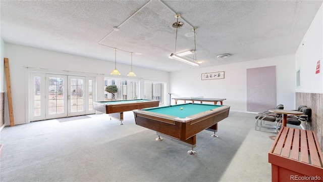 playroom with a textured ceiling, carpet floors, billiards, visible vents, and french doors