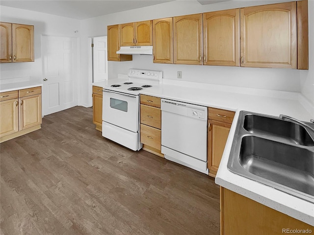 kitchen with dark wood-style floors, light countertops, a sink, white appliances, and under cabinet range hood