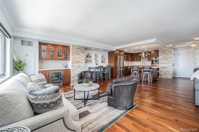 1551 Larimer St Unit 2602, Denver, CO 80202 - living area featuring wine cooler, recessed lighting, ornamental molding, visible vents, and decorative columns