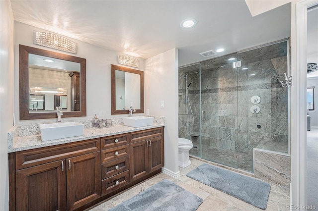 1551 Larimer St Unit 2602, Denver, CO 80202 - full bath featuring toilet, visible vents, a stall shower, and a sink