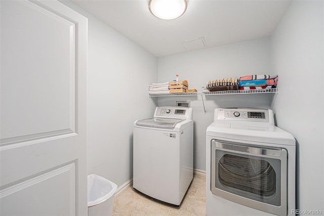 1551 Larimer St Unit 2602, Denver, CO 80202 - laundry area featuring washing machine and dryer, laundry area, and baseboards