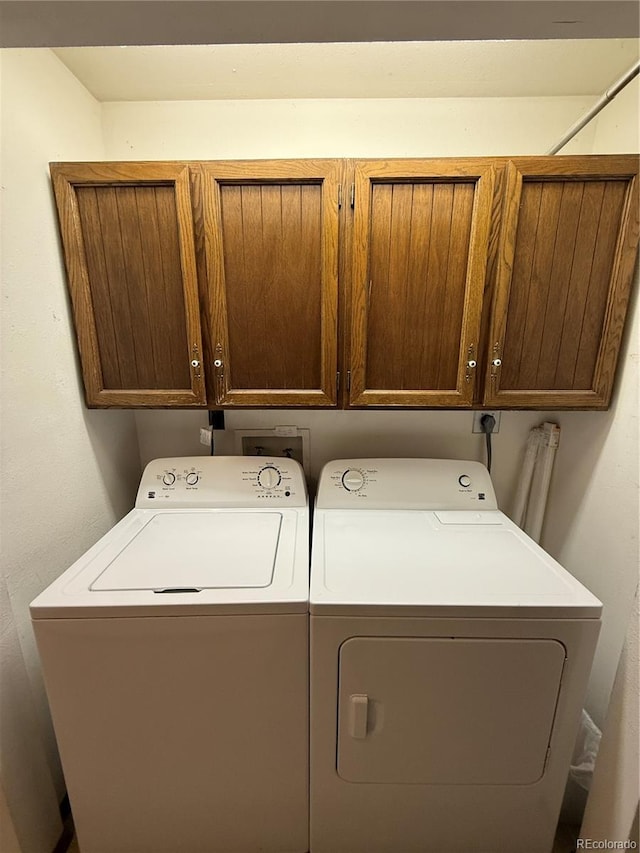 36 Woodchuck Dr, South Fork, CO 81154 - laundry room featuring cabinet space and separate washer and dryer